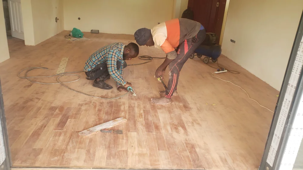 Worn-out rental property floor in Kampala needing renovation