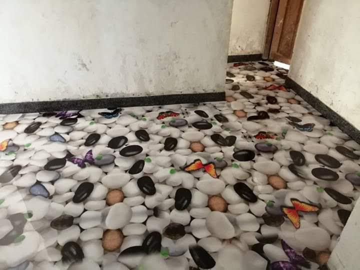 Industrial epoxy floor coating in a Uganda warehouse
