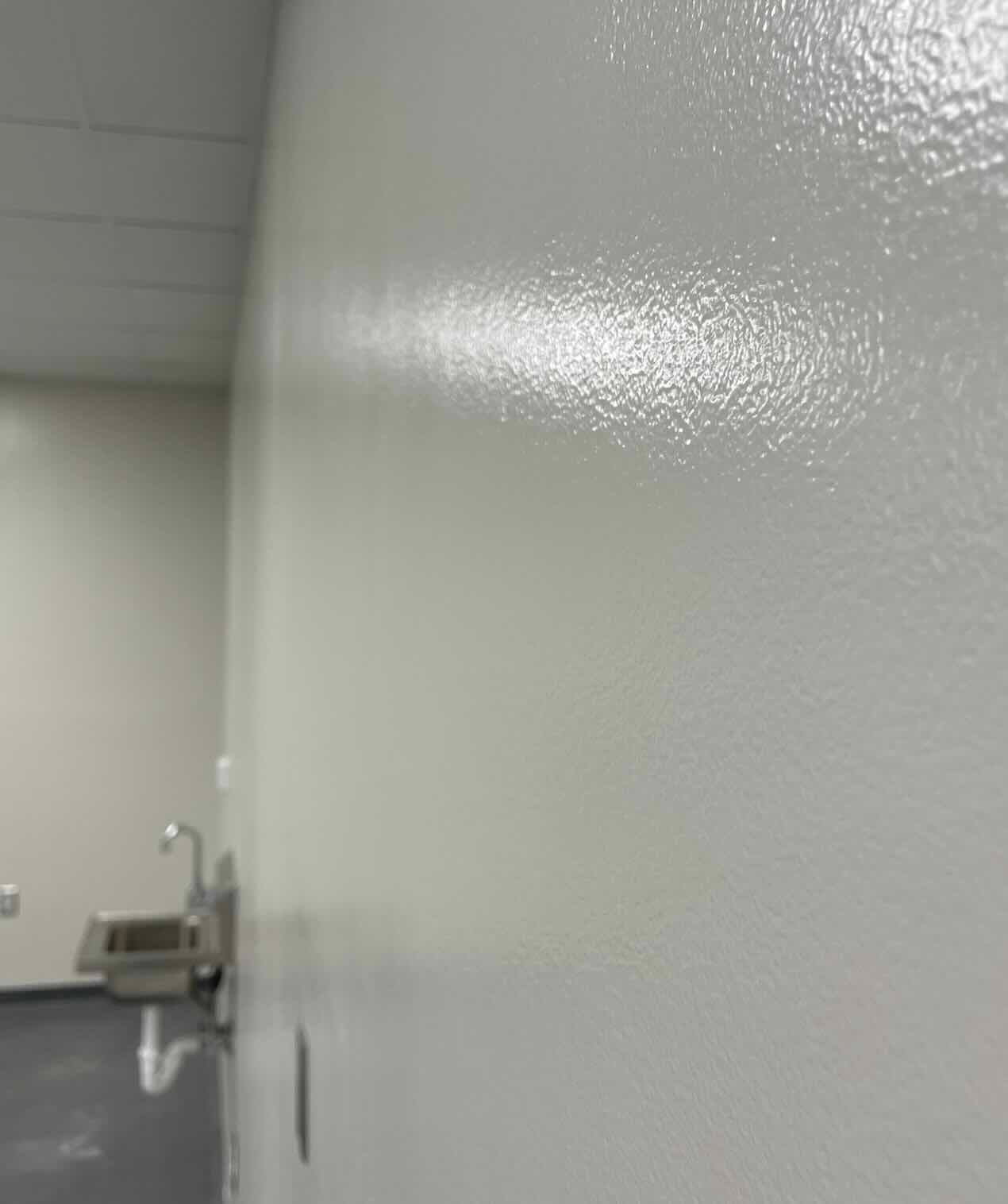 Epoxy wall coating in a commercial kitchen — hygienic wall surface in Uganda