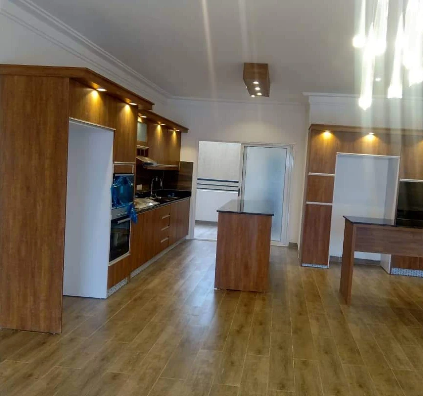 Warm hardwood floor with natural grain in a Ugandan home — FloorCraft Uganda