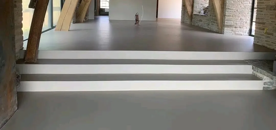 Smooth seamless microtopping floor in a Kampala home installed by FloorCraft Uganda