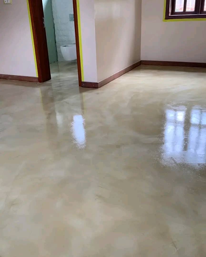 Smooth microtopping floor installation in a Kampala home — FloorCraft Uganda