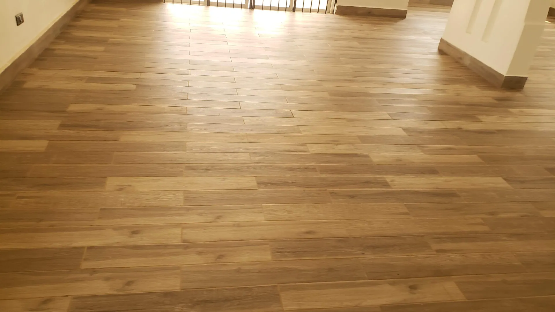 FloorCraft Uganda craftsmen finishing a microtopping floor in Kampala, Uganda