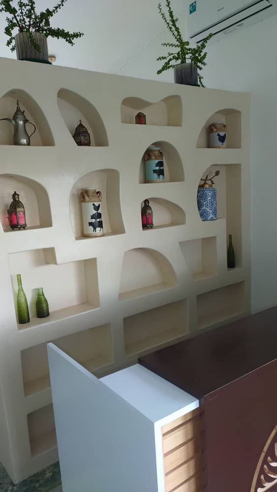 Microtopping living room feature wall in a modern Uganda home